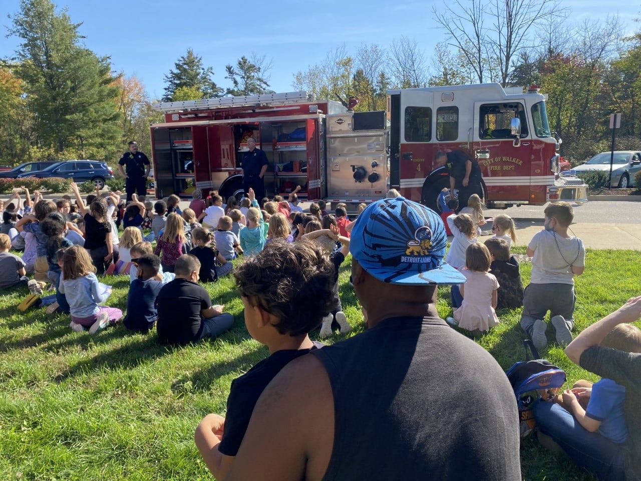 Students and parents watch presentation