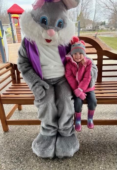 Easter Bunny with cute kid wearing pink