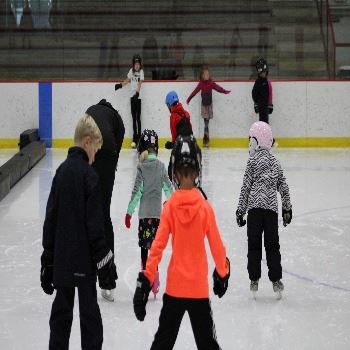Learn to Skate participants helping each other