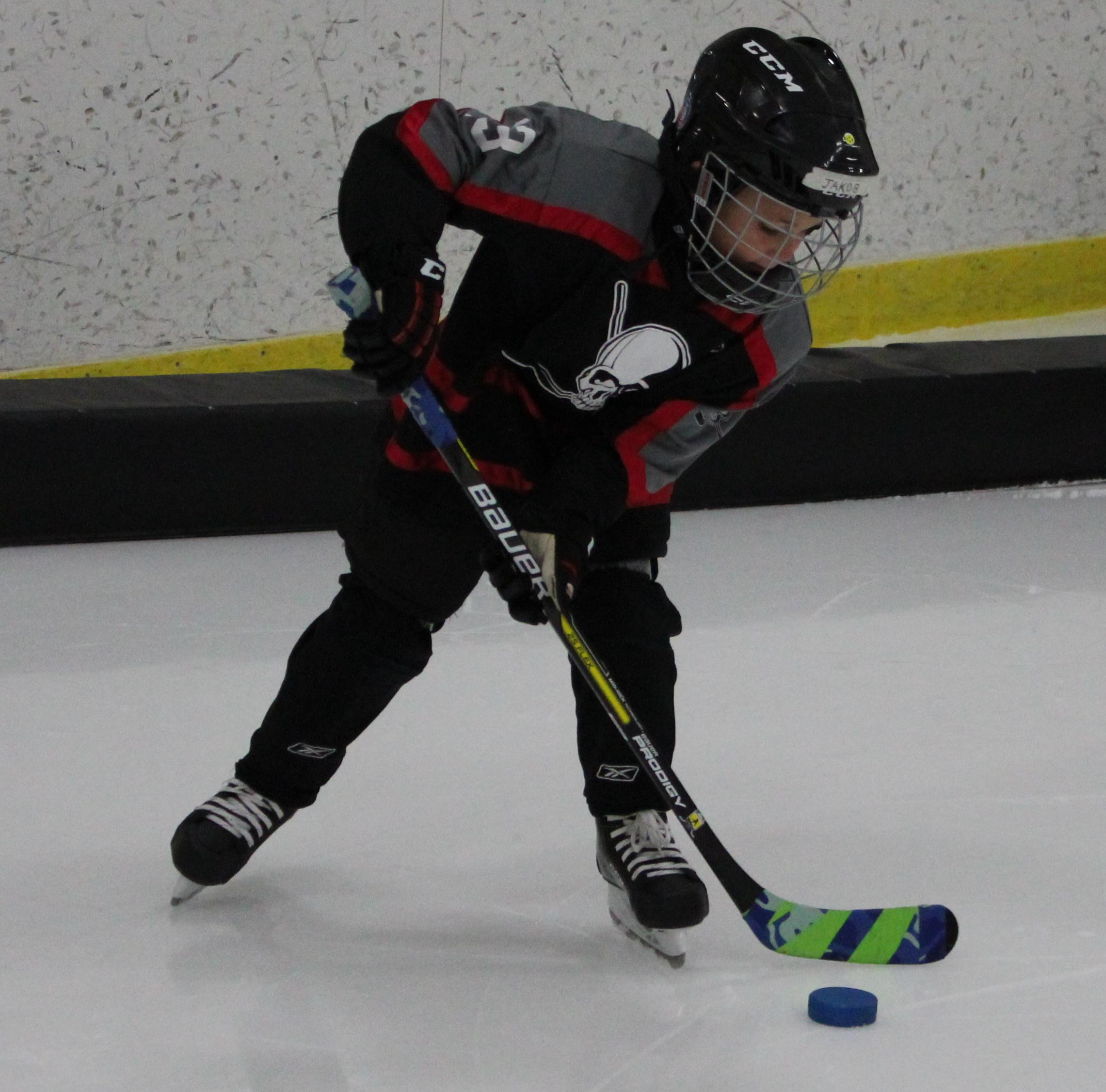 Learn to Play Hockey player on ice