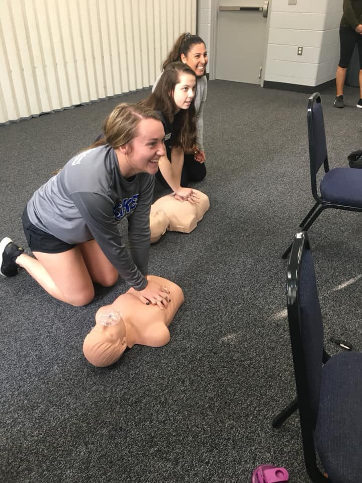 Students learning CPR
