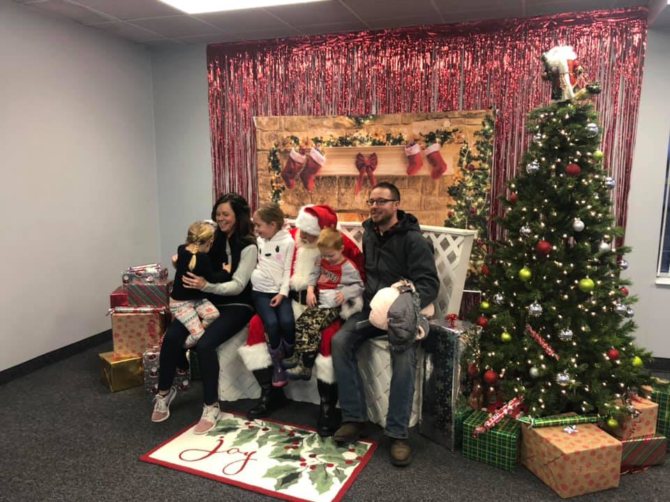 People posing with Santa