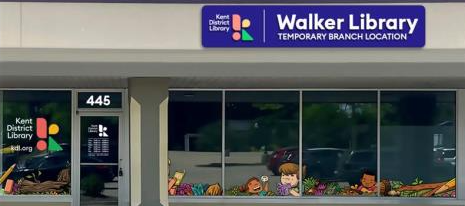 Image of storefront with a blue sign above